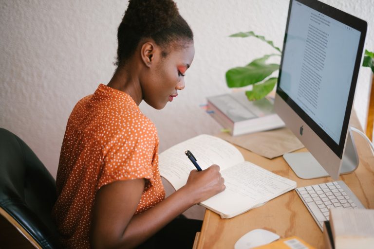 writing in front of computer